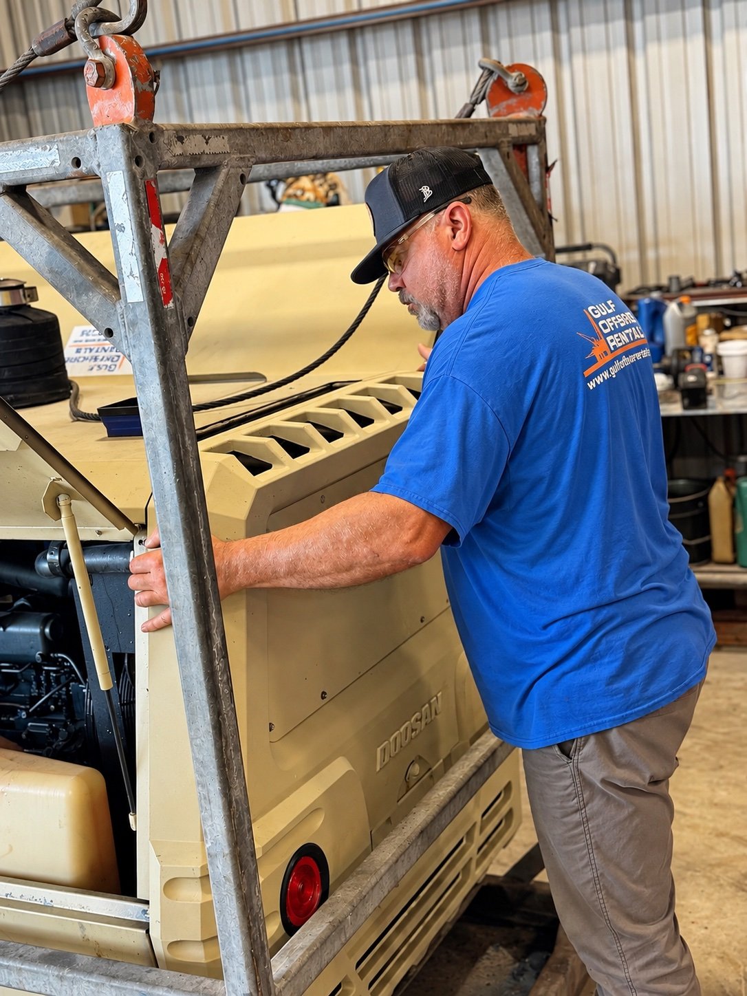 GOR technician servicing a Doosan unit in the shop