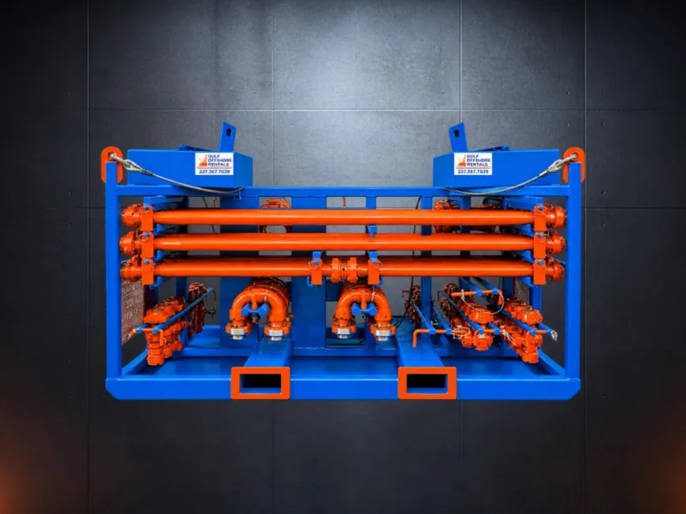 Gulf Offshore Rentals pipe rack with orange flow iron and branded control boxes